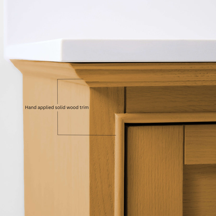 Close-up of hand applied solid wood trim on the Audrey bathroom vanity in Sienna finish with White Quartz top.
