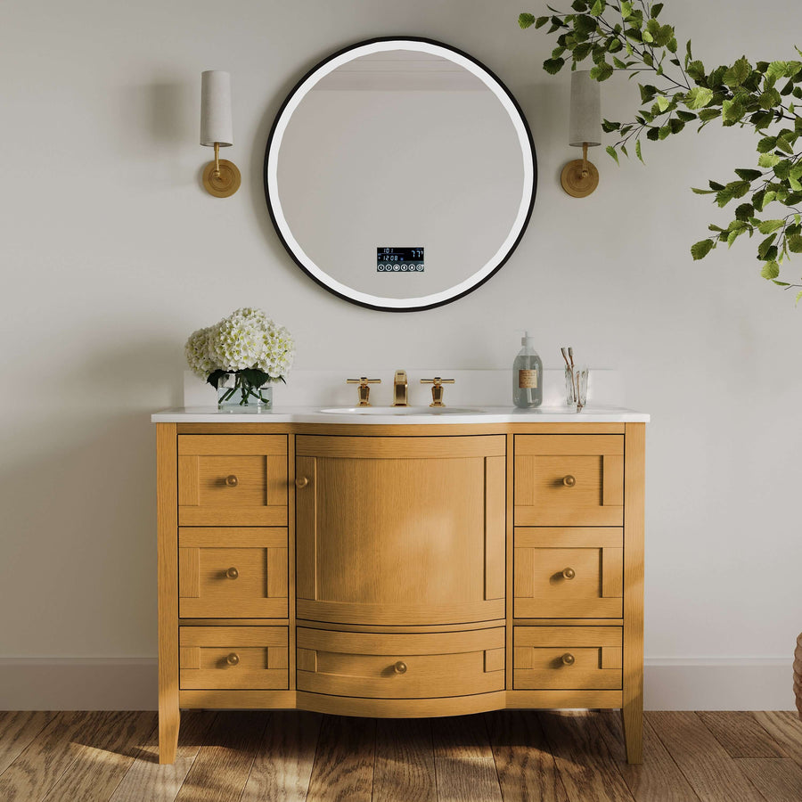Lauren bathroom vanity featuring Sienna finish, white quartz top, and round mirror in modern bathroom setting.