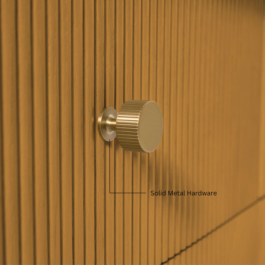 Close-up of gold-finished knob on Momo bathroom vanity collection showcasing solid metal hardware.